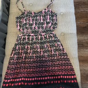 Knee length dress with cut outs on the side